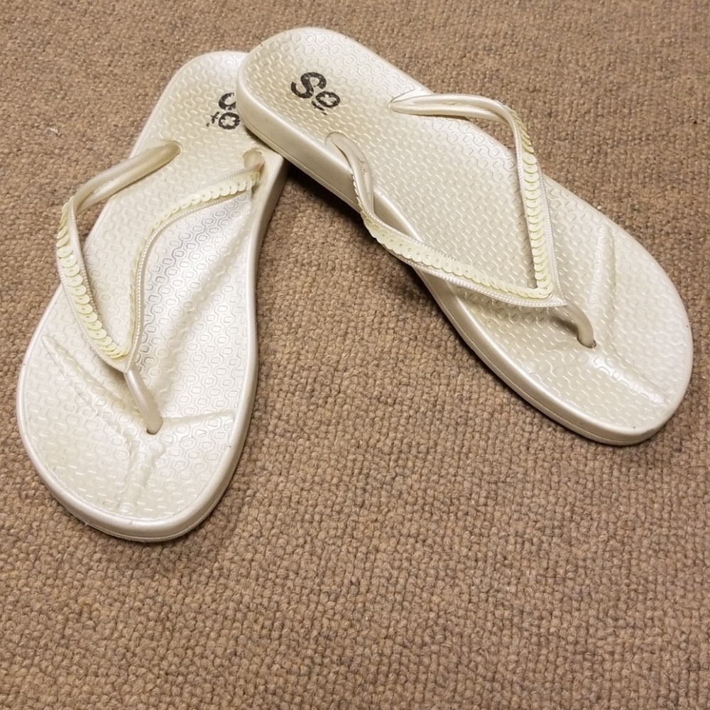Ivory flip flops